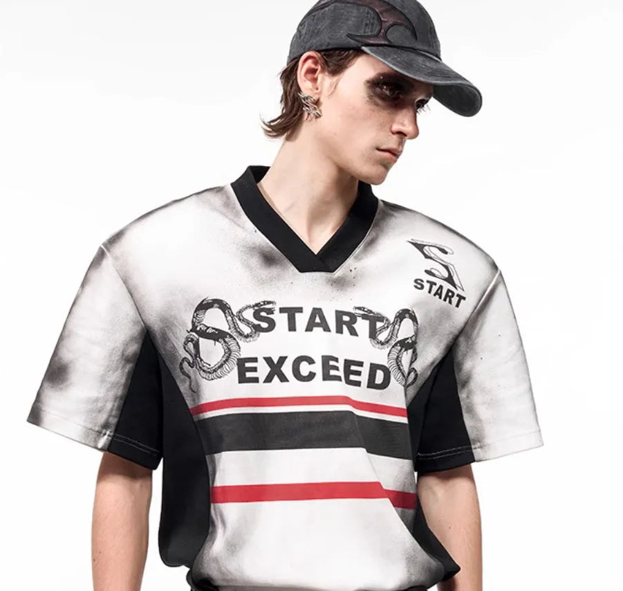 Korean-style women's V-neck short sleeve top with padded shoulders and a black and white letter snake pattern print.