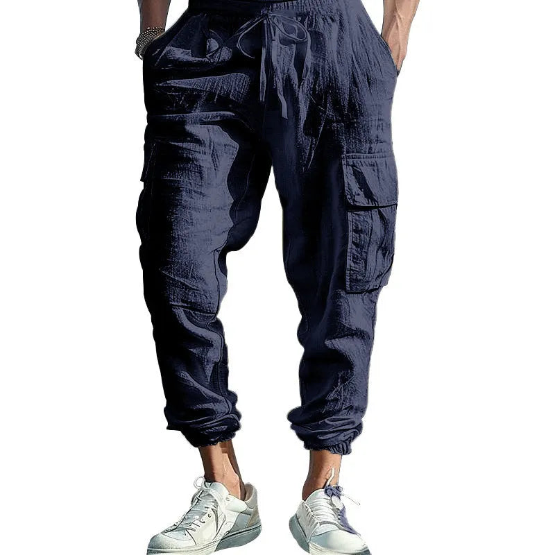 Men's linen cargo trousers with multi-pocket design in army green, black, navy blue, and yellowish brown