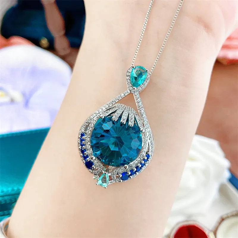 Blue geometric crystal pendant necklace with water wave chain, women's jewellery with fireworks-cut gems