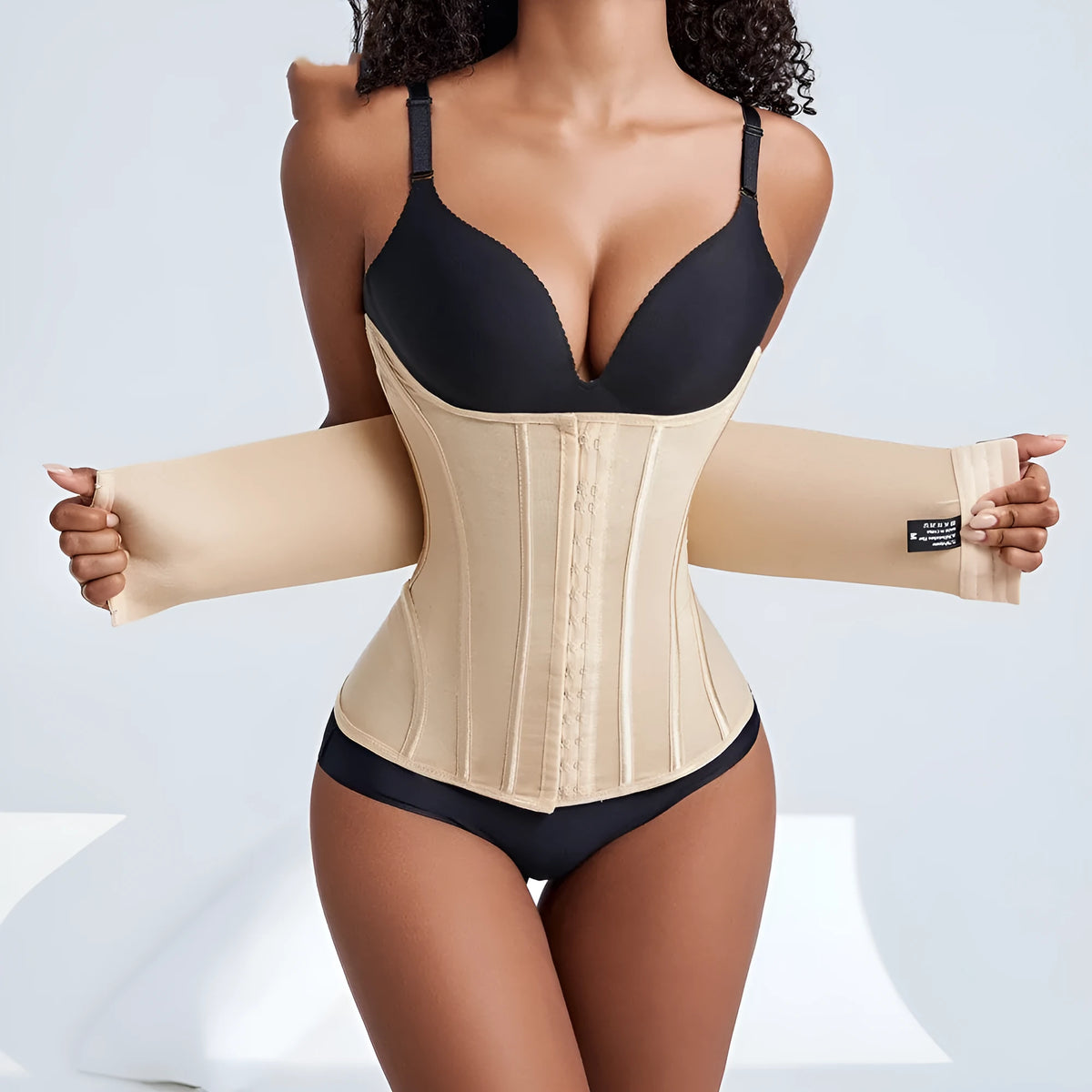 Nylon belly band waist trainer with adjustable tie in black and apricot colours on size chart