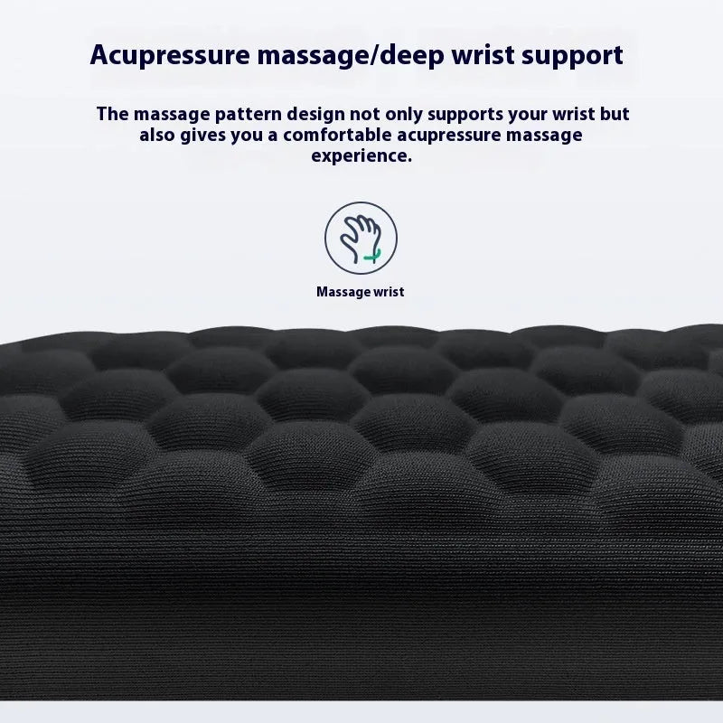Black memory foam mouse wrist pad with a leather-style cover on a wooden desk