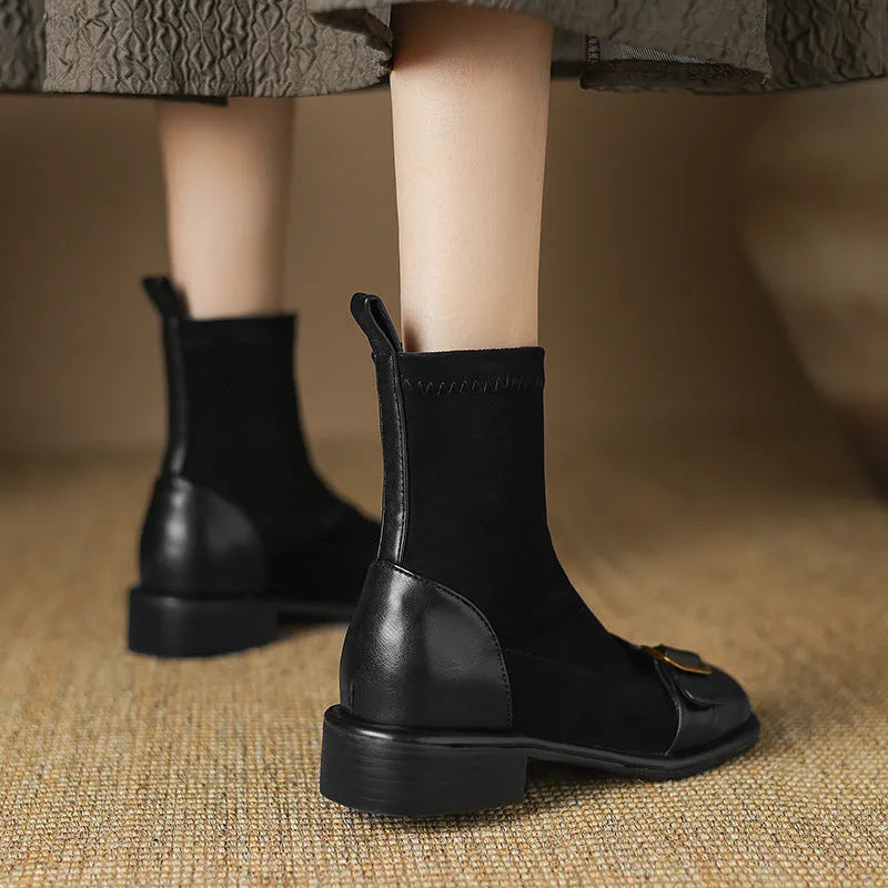 Black women's low heel Martin boots with front lace-up and buckle detail stitching.