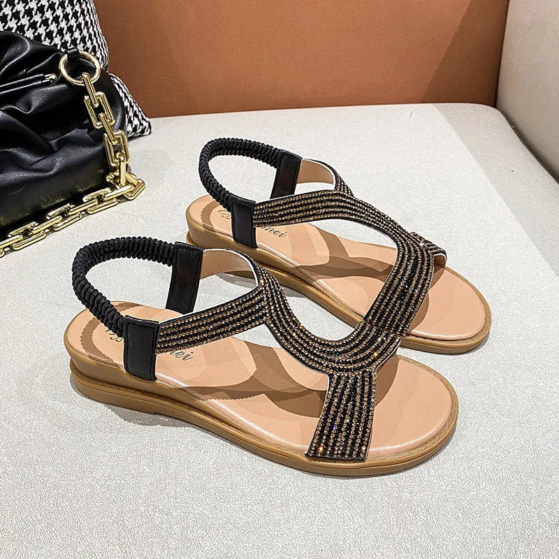 Women's patent leather summer sandals with rhinestone decoration in gold colour