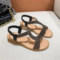 Women's patent leather summer sandals with rhinestone decoration in gold colour