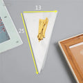 Transparent triangle-shaped plastic packaging bag with a twisted wire tie closure.