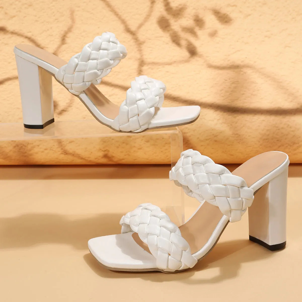 Square toe flip-flops with chunky heel and woven twisted design in white colour