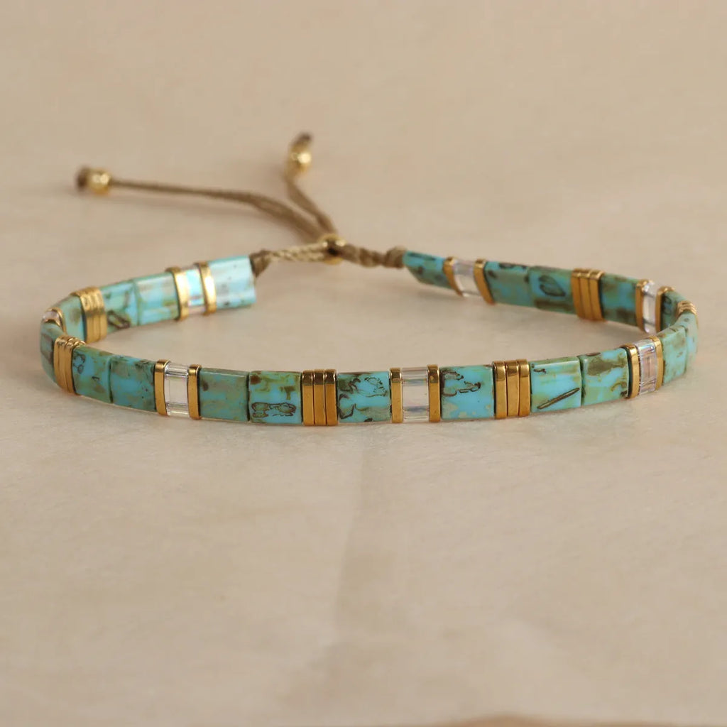 Geometric glass beaded bracelet in retro green colour with round elements