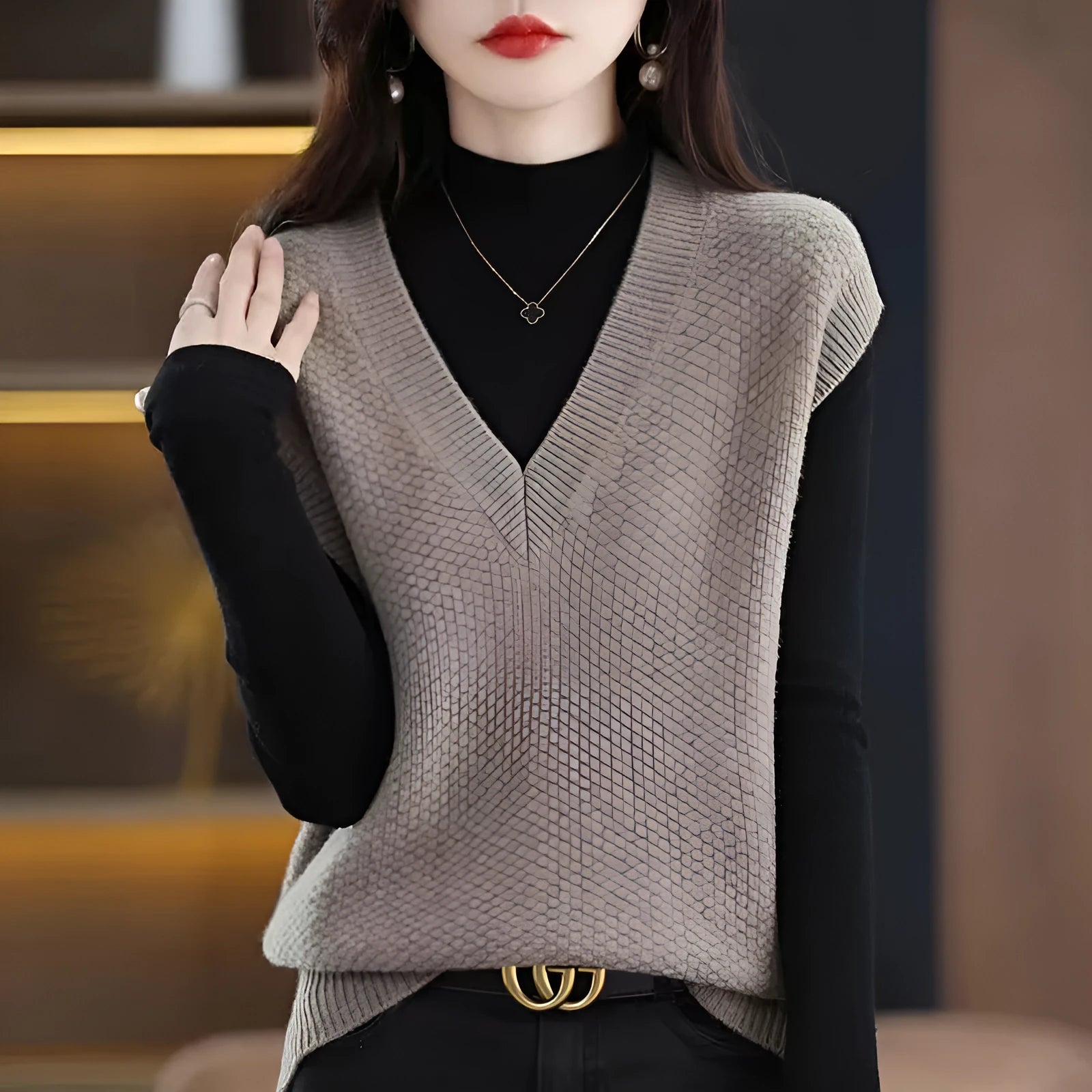 Women's creamy-white V-neck sleeveless knitted vest with a raised 3D stereoscopic pattern texture.