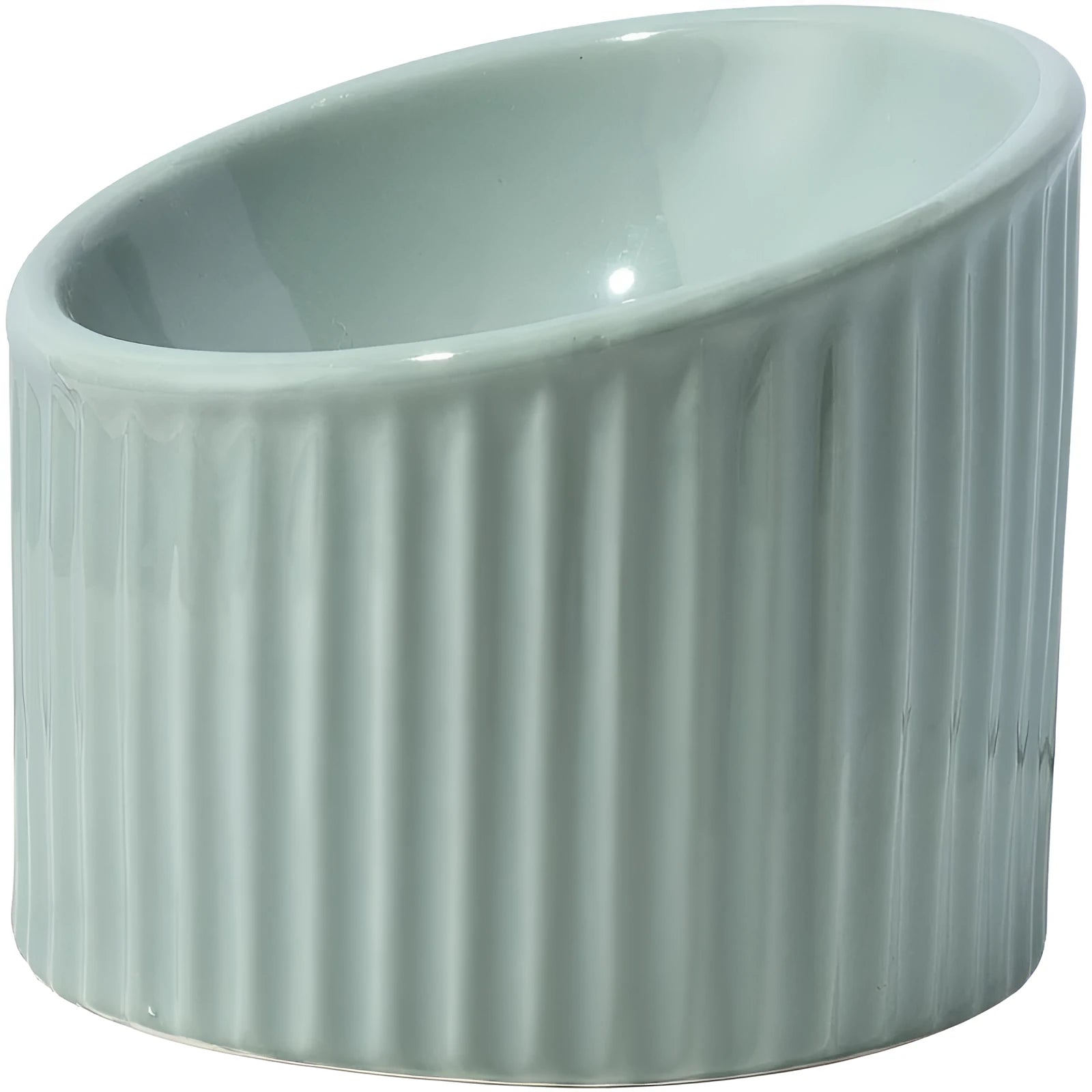 Dark green ceramic elevated cat bowl on a table, showing its raised height and round, tilted shape.