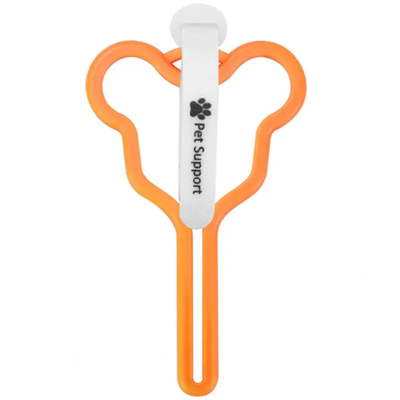 A hands-free dog poo bag holder with a fixed clip and adjustable Velcro strap attached to a dog lead.