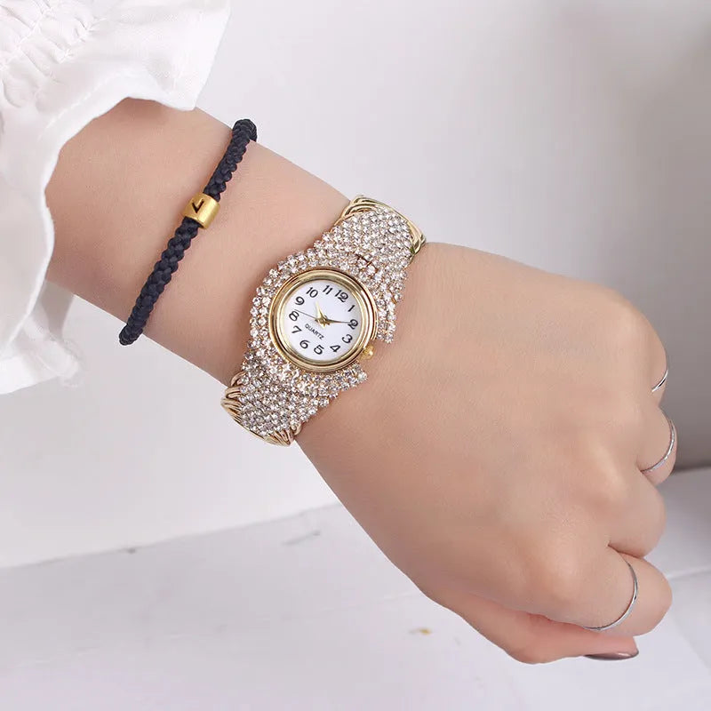 Women's 33mm quartz watch with circular dial, metal case, alloy strap, and open buckle