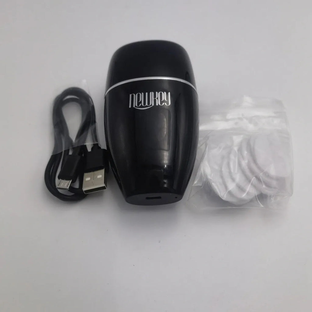 Black and white electric lip plumper device with silicone tip and 3 speed buttons