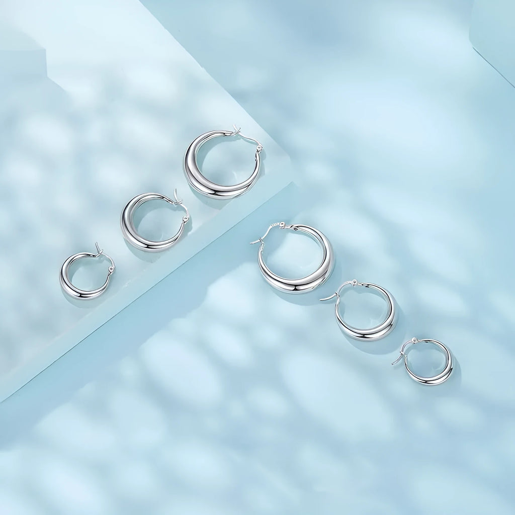 Geometric ring clip earrings with silver needle detail in electroplated copper