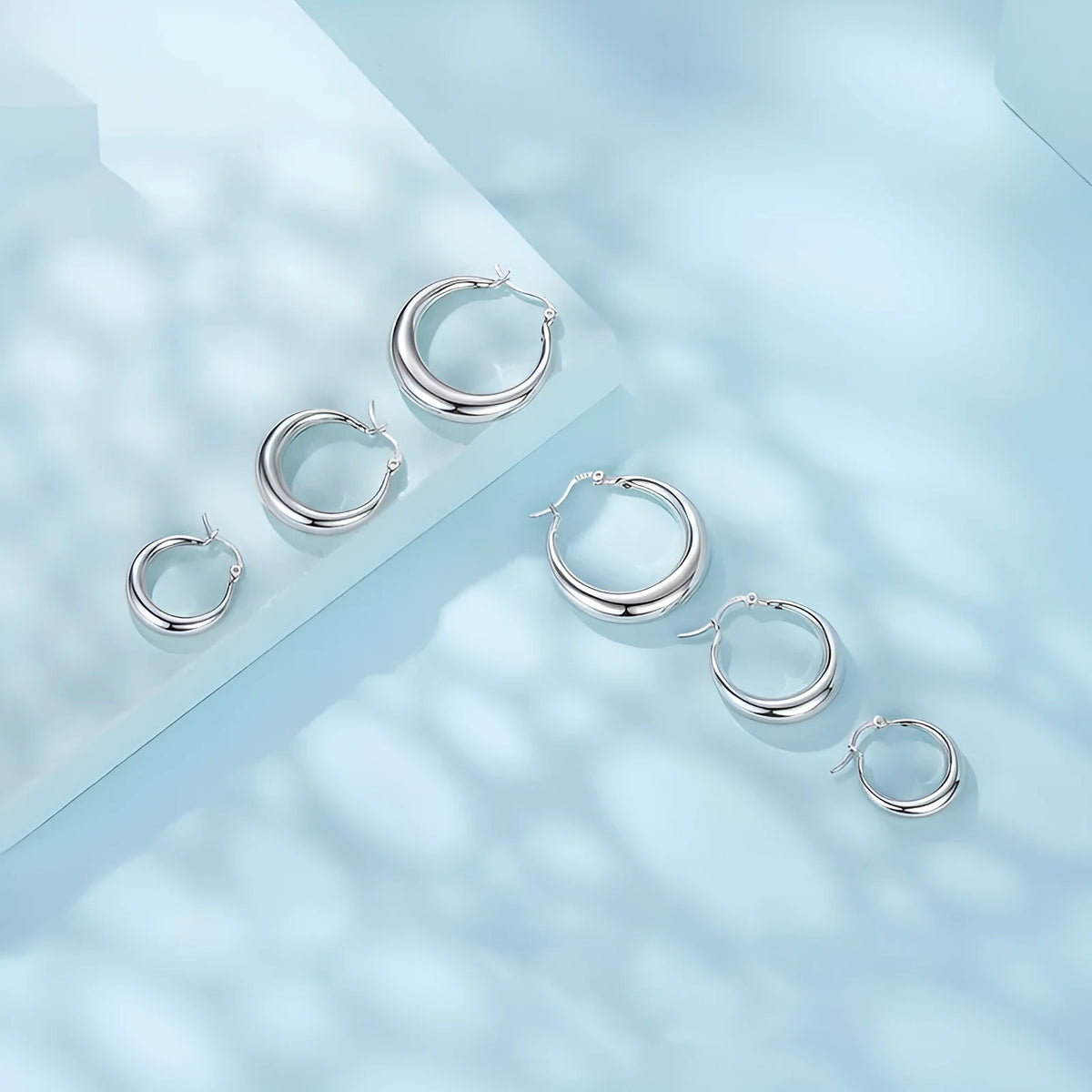 Geometric ring clip earrings with silver needle detail in electroplated copper