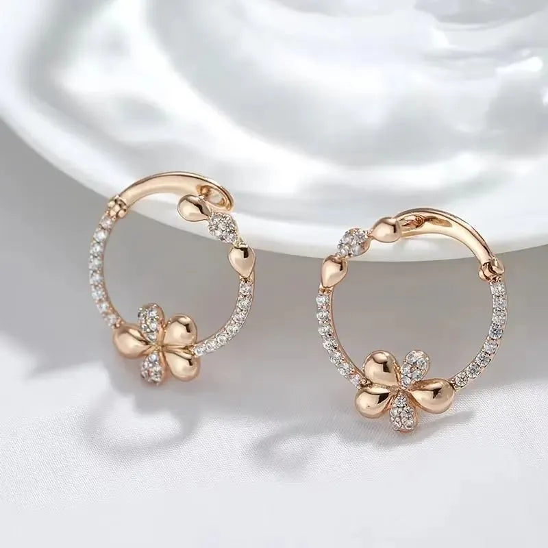 A pair of round copper hoop earrings for women with an electroplated finish.