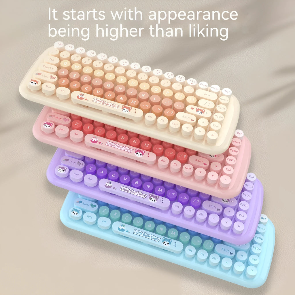 Compact pink wireless keyboard and mouse set with USB receiver on a desk