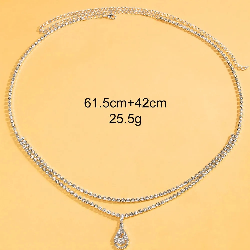 Gold waist chain with water drop pendant and tassel decoration, lobster buckle closure