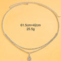 Gold waist chain with water drop pendant and tassel decoration, lobster buckle closure