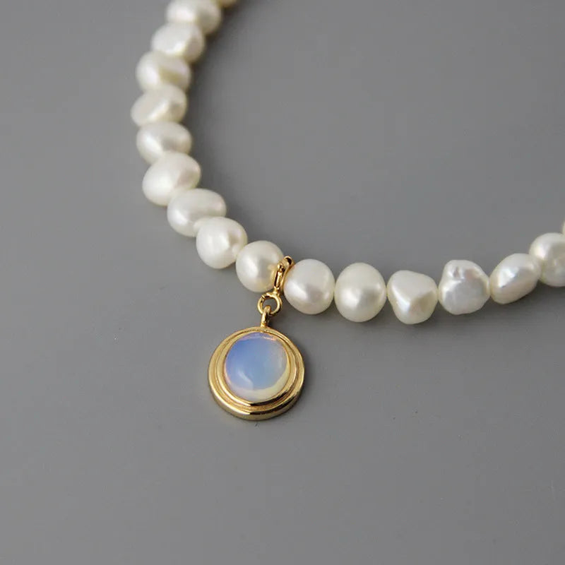 Geometric sterling silver pendant necklace with irregular freshwater pearls on an adjustable silver chain