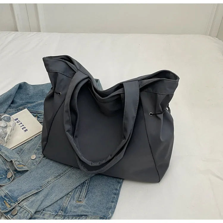 Soft folding Oxford cloth tote bag with shoulder handle in multiple colour options.