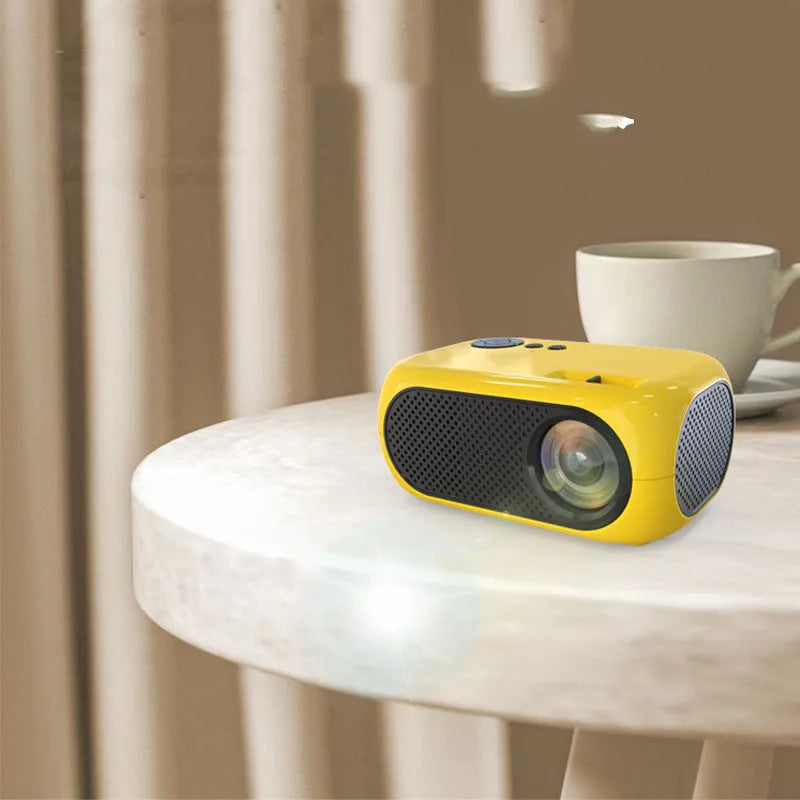 M24 micro mini projector in gold or white ABS plastic with power adapter and cables