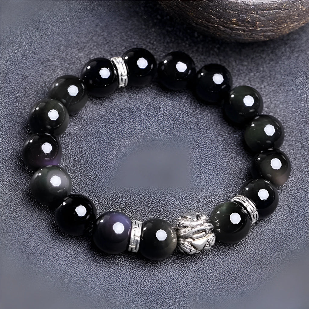 Silver 999 obsidian bracelet with lucky colour eye pattern showing male 12mm and female 10mm sizing options