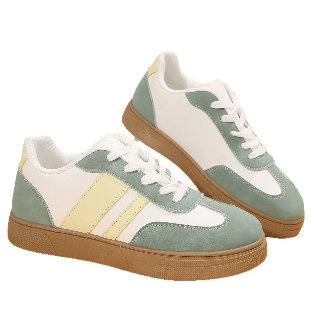 Green women's retro sports shoes with cross strap detail and round toe