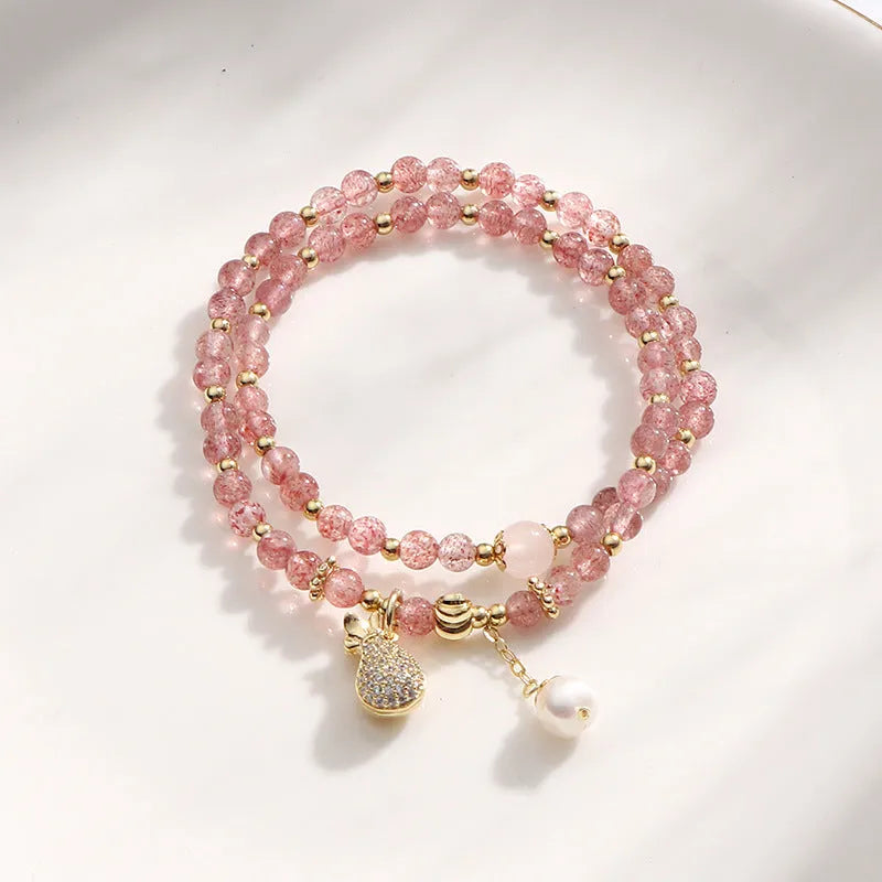 Women's strawberry quartz crystal bracelet with a geometry shape design.