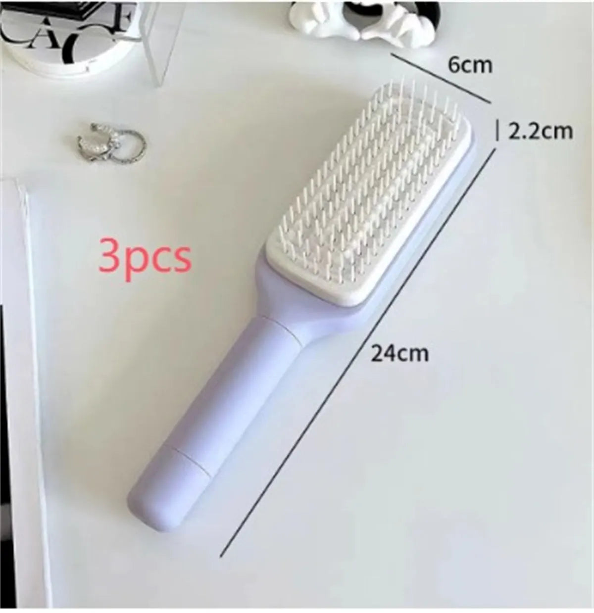 Roland purple self cleaning hair brush with rotating handle and anti-static bristles