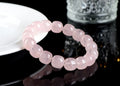 Pink crystal geometric barrel bead bracelet with 11-12mm beads on a wrist.