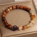 Women's pineapple yellow bracelet with yellow tower crystal, ebony amethyst beads, and pearl accents