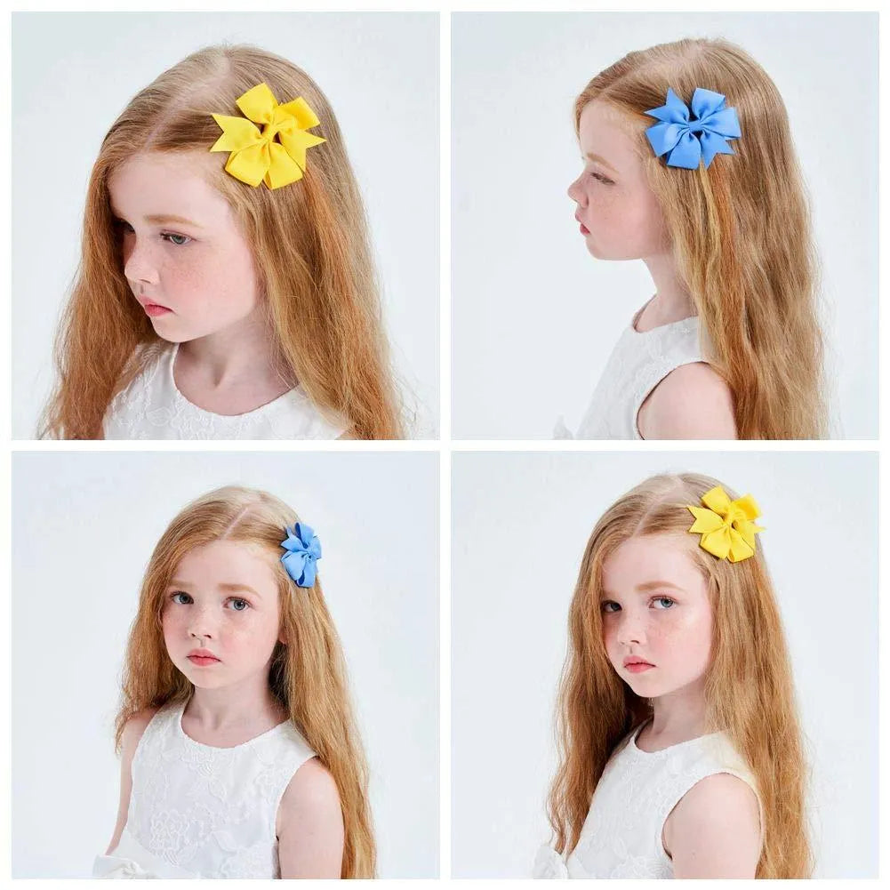 Set of 20 colourful 3-inch grosgrain ribbon pinwheel hair bows with alligator clips for toddlers.