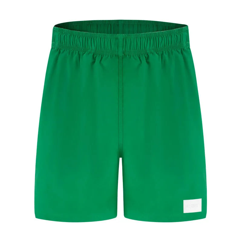 Men's solid colour quick-dry nylon sports casual shorts in straight leg fit.