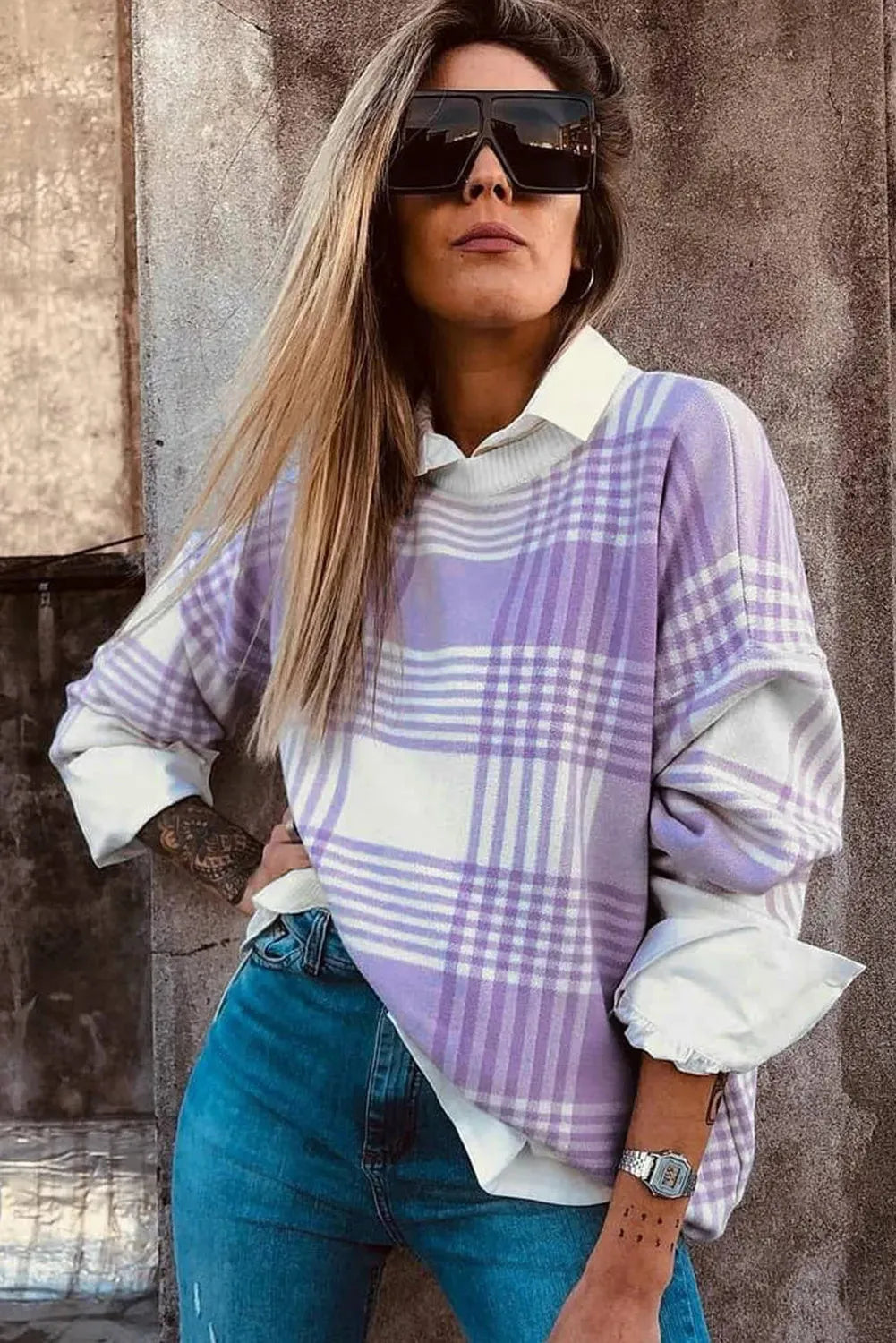 Lilac plaid print loose sweater with ribbed trim and long sleeves on hanger