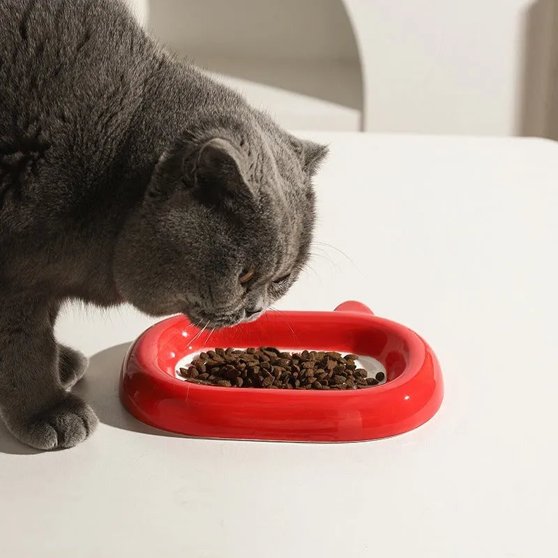 Ceramic pet bowl with an animal design, suitable for cat food or dog water.