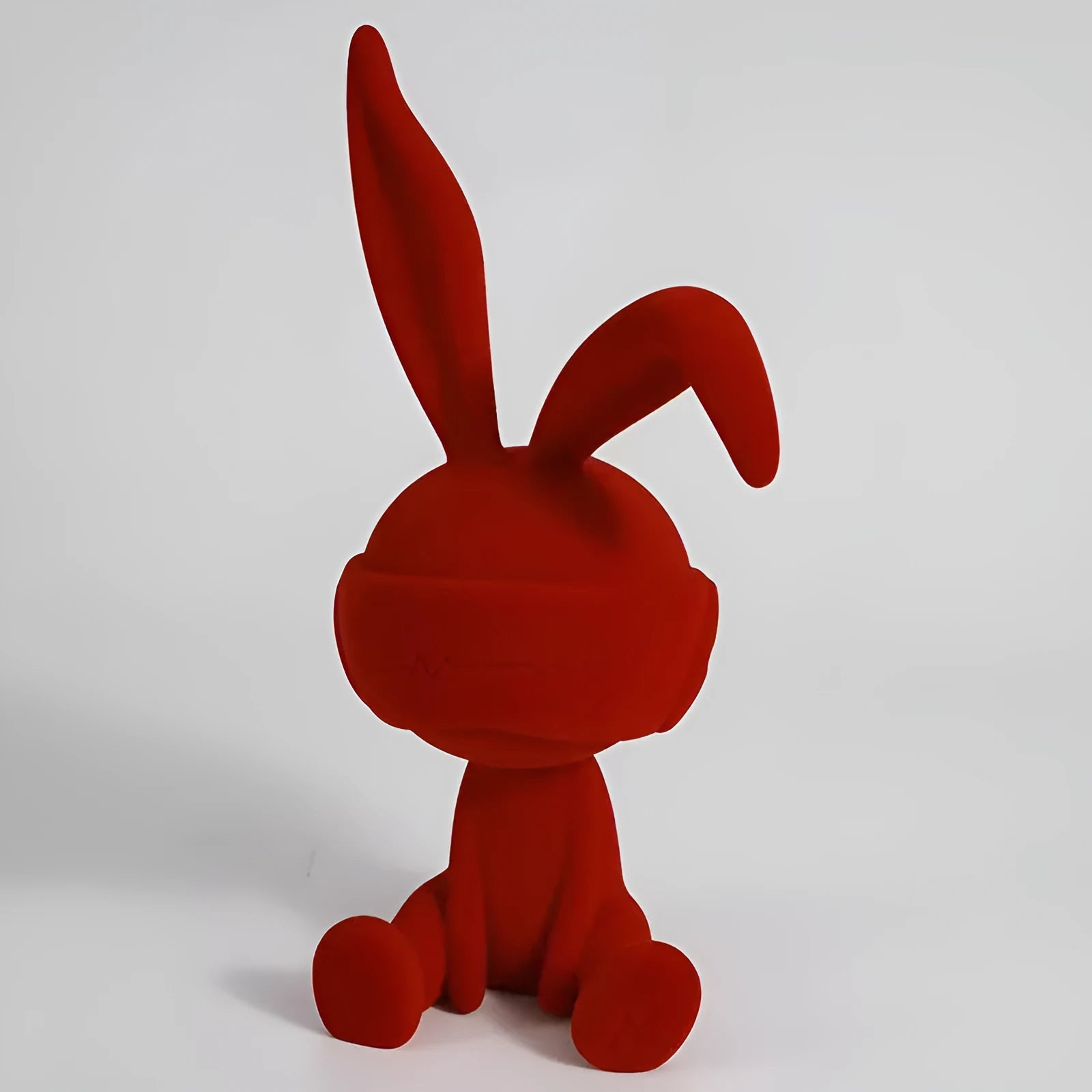Suede blindfold rabbit resin table ornament in green, blue, or red colour options