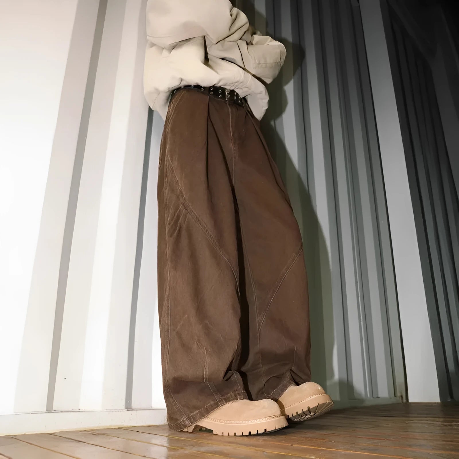 Men's apricot straight-leg loose fit trousers with elastic waist on a hanger.
