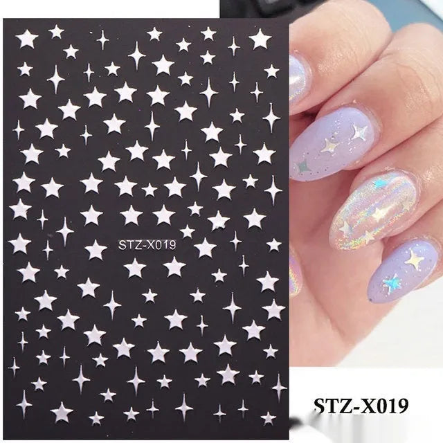 Cartoon love pattern nail art sticker decals in black and silver colours on a plastic sheet.