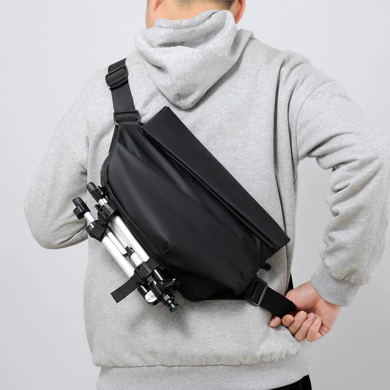Men's black PU leather crossbody sling backpack with shoulder strap and zipper opening
