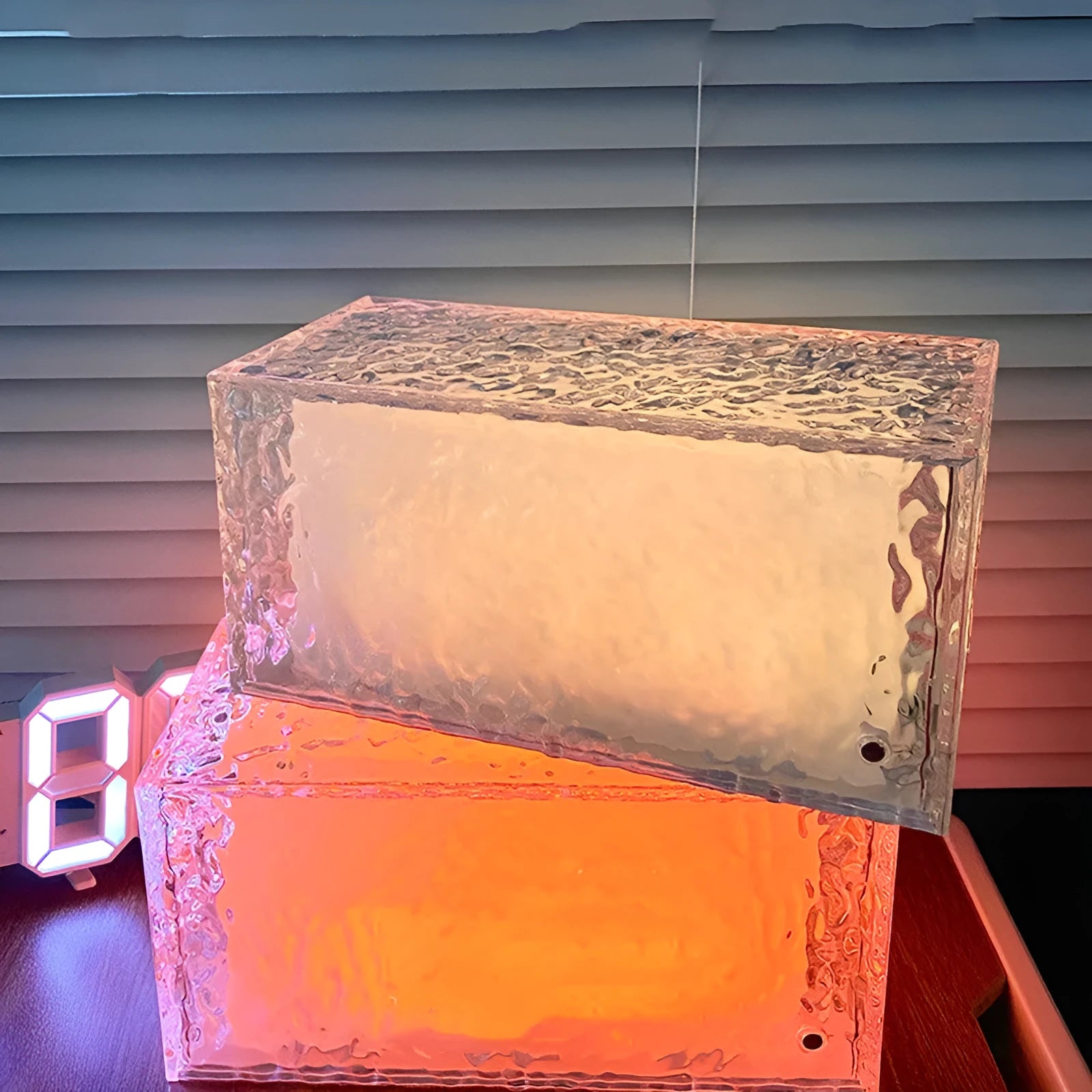Clear acrylic geometric ice cube shaped night light with colour changing LED lights inside.