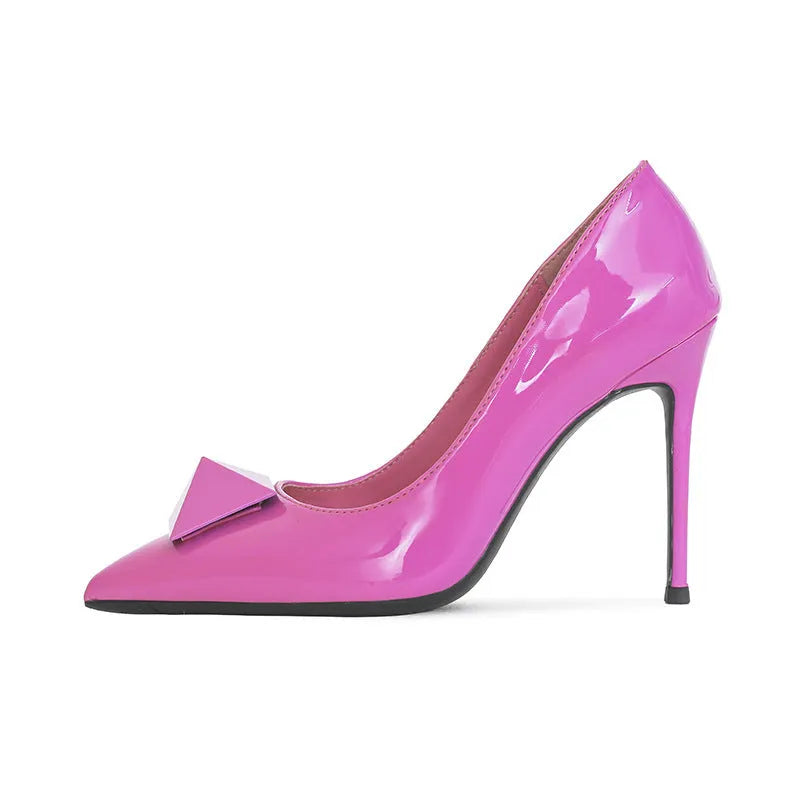 Pink patent leather women's stiletto heels with pointed toe and rivet buckle fastening