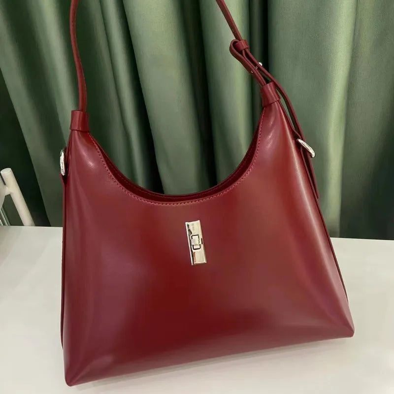 Genuine leather crossbody shoulder bag with dumpling shape and sandwich pocket design