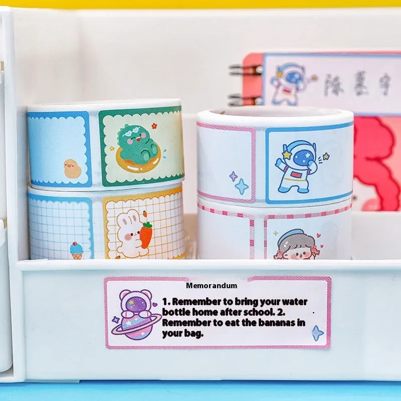 Roll of colourful cartoon name stickers with dinosaur, astronaut, rabbit, and girl designs for labelling.