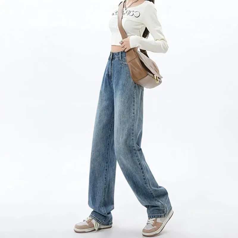 Woman wearing retro blue high waist wide leg jeans with a straight leg cut.