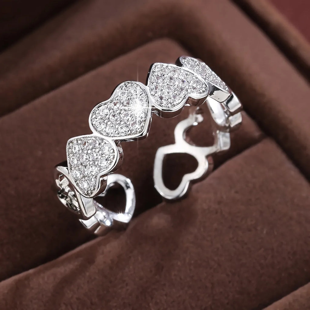 Adjustable opening couples ring with love heart design in gold or silver colour on geometric copper band