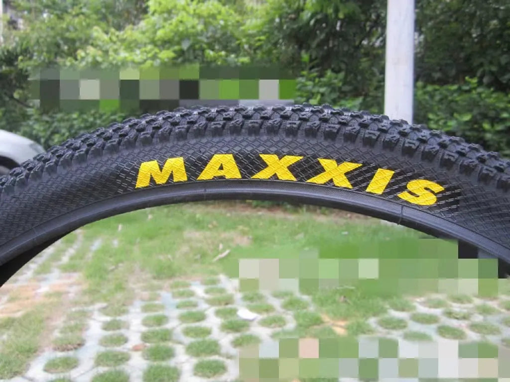 Mountain bike ultralight puncture proof tyre showing tread and white label sidewall option.