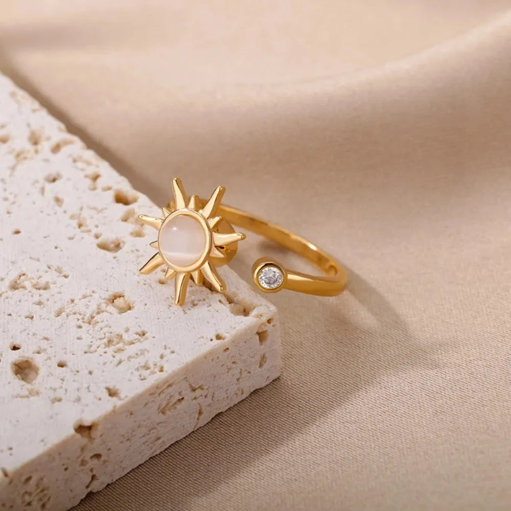 Simple copper adjustable decompression ring in gold or platinum finish, showing open mouth design.