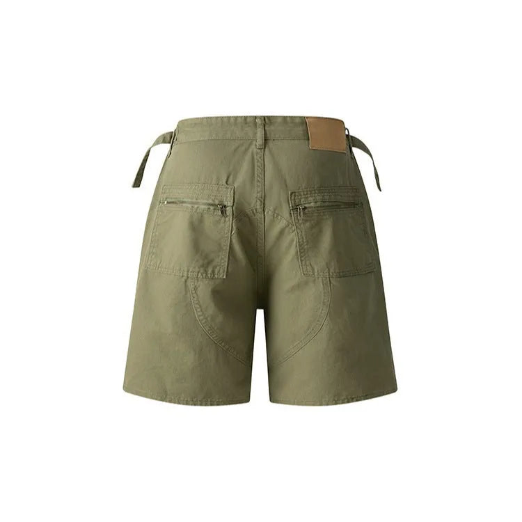 Retro loose-fit workwear shorts in washed cotton fabric with a zipper fly, shown in grey colour.