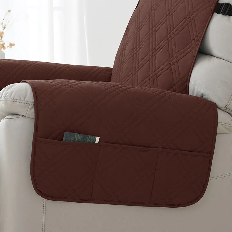 Quilted burgundy sofa cover stretched over a single seat cushion, showing three-line stitching pattern.