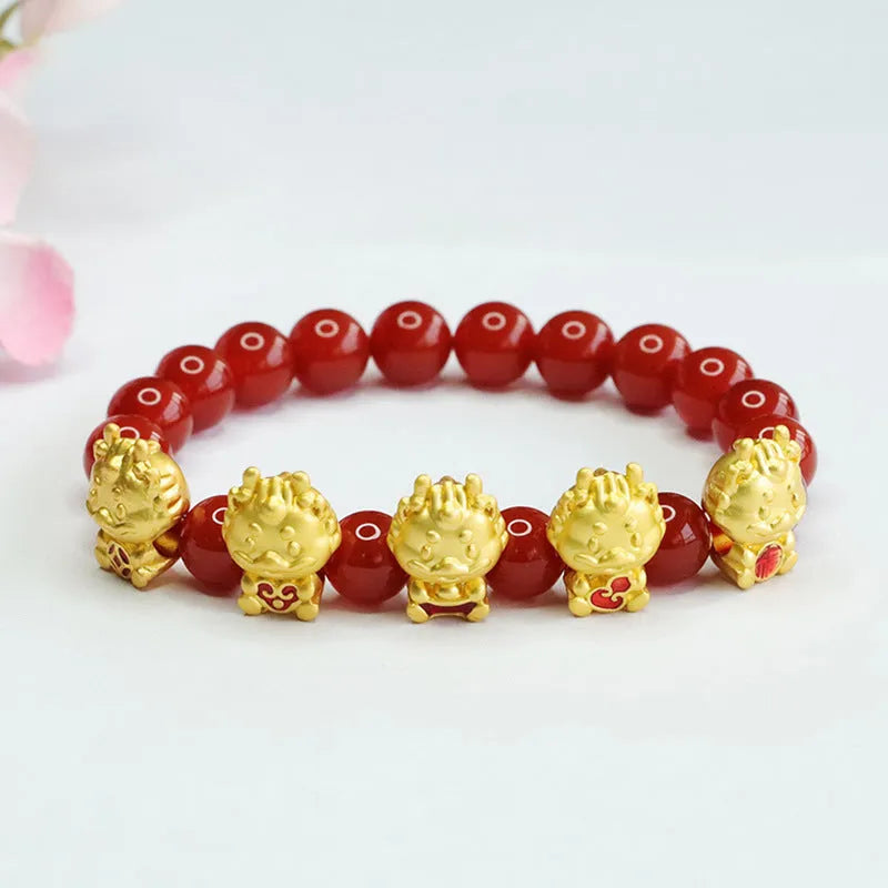 Close-up of a red agate bracelet bead carved with a Chinese Five Blessings Dragon design.